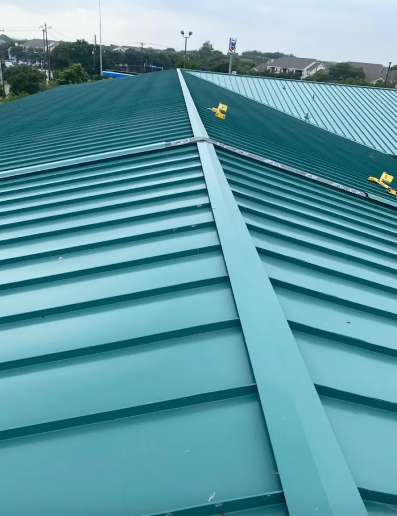 Green commercial metal roof ridge and valley for Metal Roof Repair in Adel